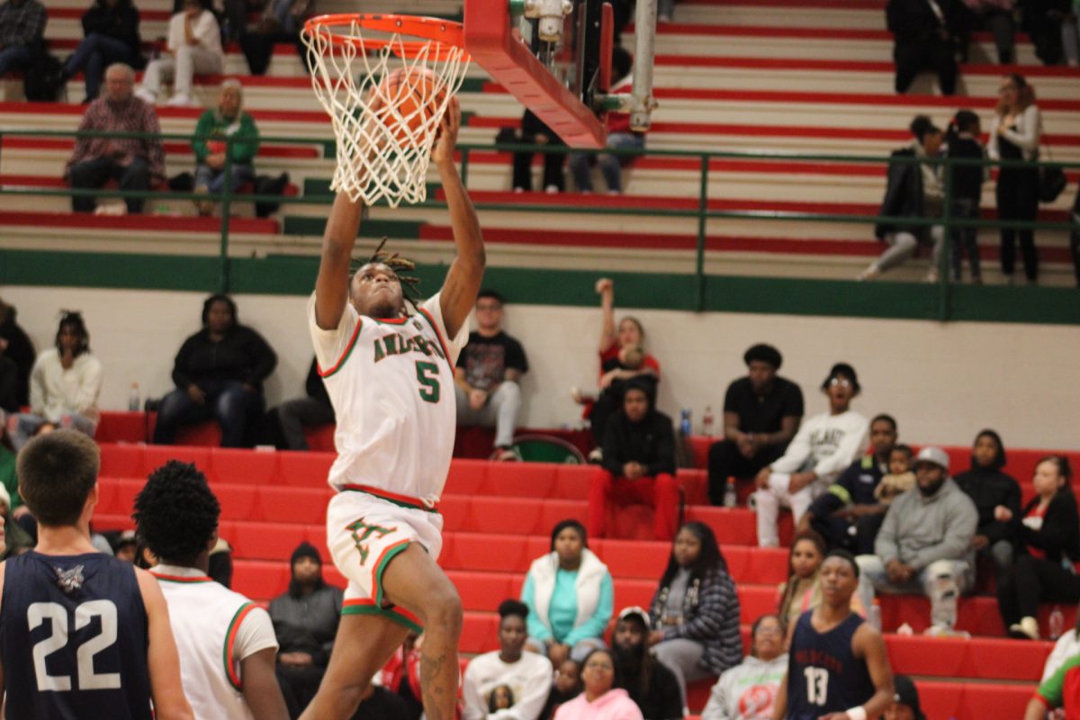 Damien King goes up for a layup during a game against the Indianapolis Home School team.