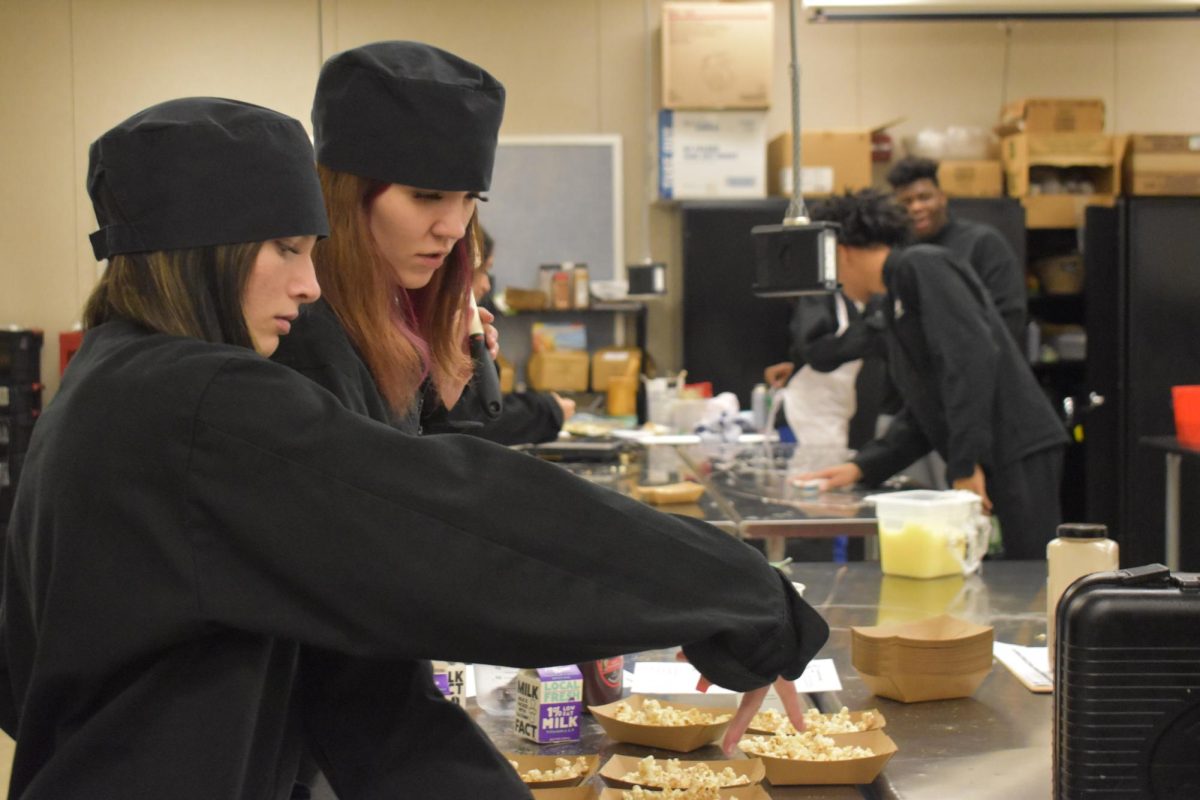 Culinary students work together to make different kinds of popcorn at the D26 Career Campus. Students had a choice to make a variation of popcorn, such as sweet and spicy, etc.