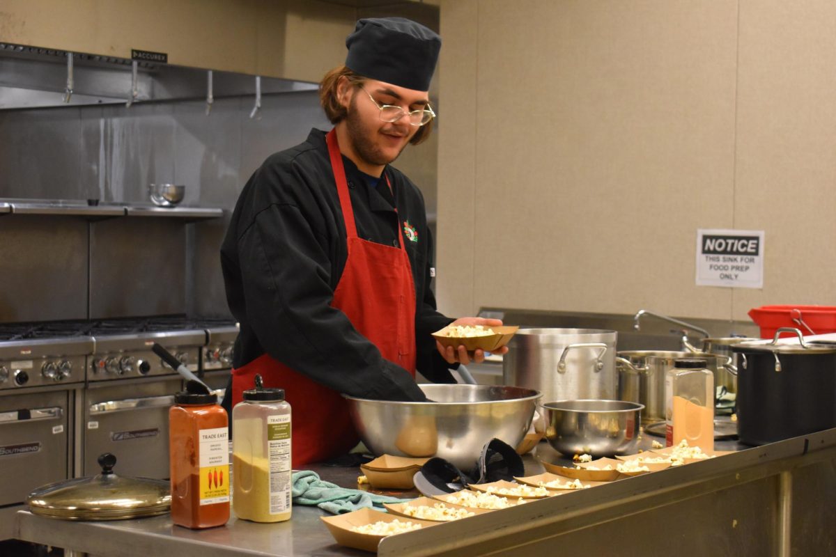 Culinary student Zachery Lowe, makes some spicy popcorn at the D26 career campus. Students had a choice in making different types of popcorn such as spicy, sweet, movie style, and more.