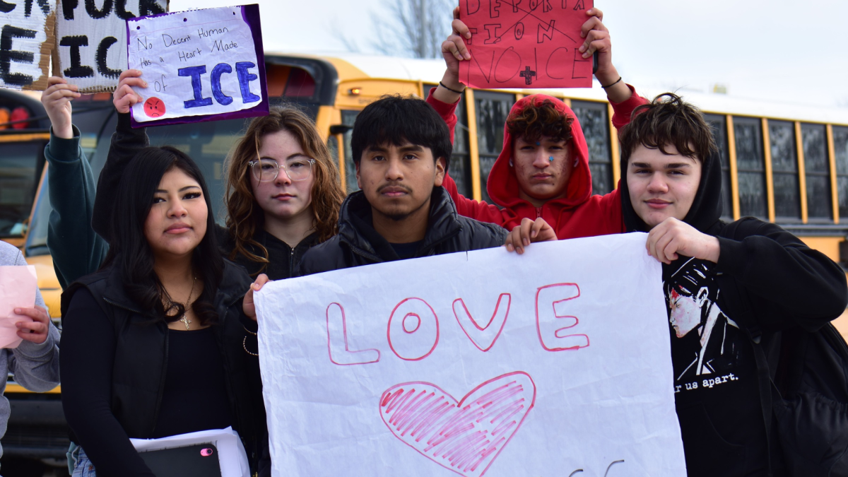 Five students pose up for a picture after the end of their protest. 