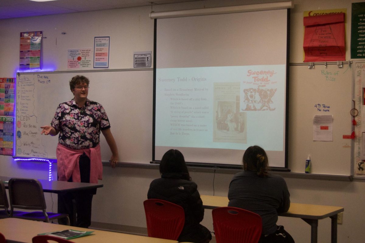 Mr. Boyle teaching film club the history of Tim Burton's "Sweeney Todd: The Demon Barber of Fleet Street"