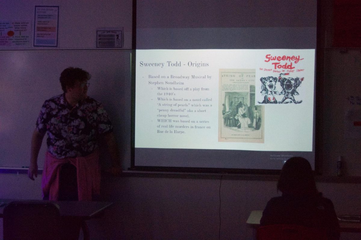 Will Boyle ledes a film analysis during film club.