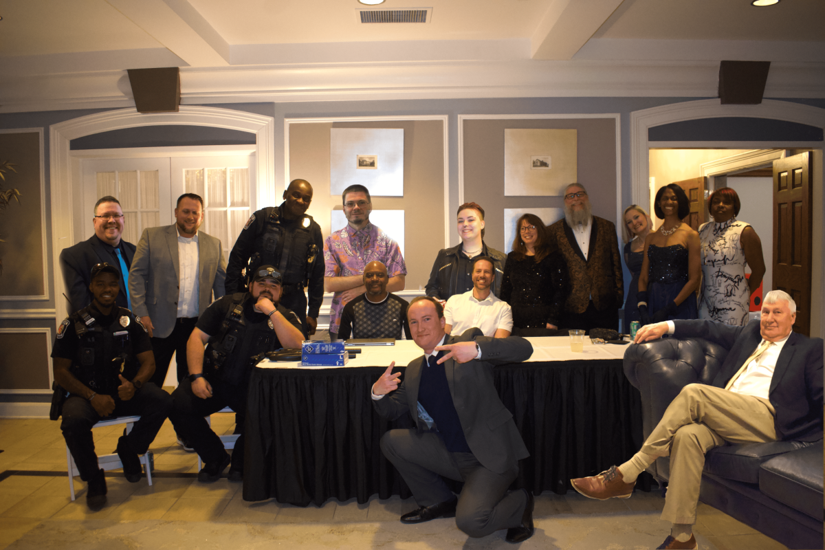 All staff who helped set up prom pose for a picture. At the end of the event, the staff was asked to pose for a picture.